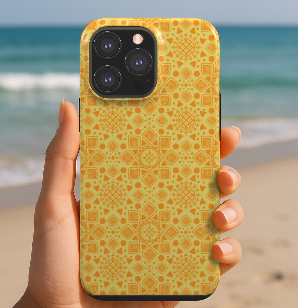 An artist designed tough phone case with a Mandala Sun design being held.