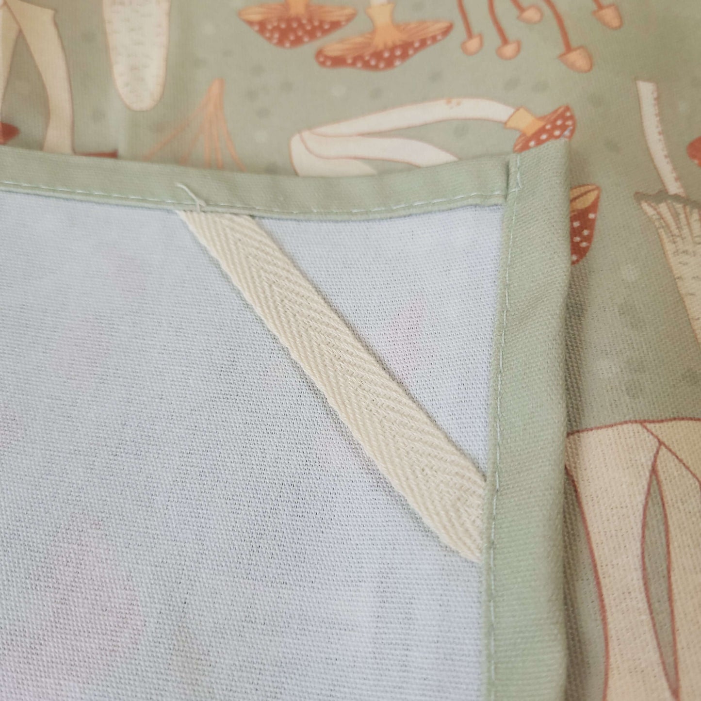 Close-up fabric detail of the Fabulous Funghi mushroom tea towel, showcasing premium botanical print quality.