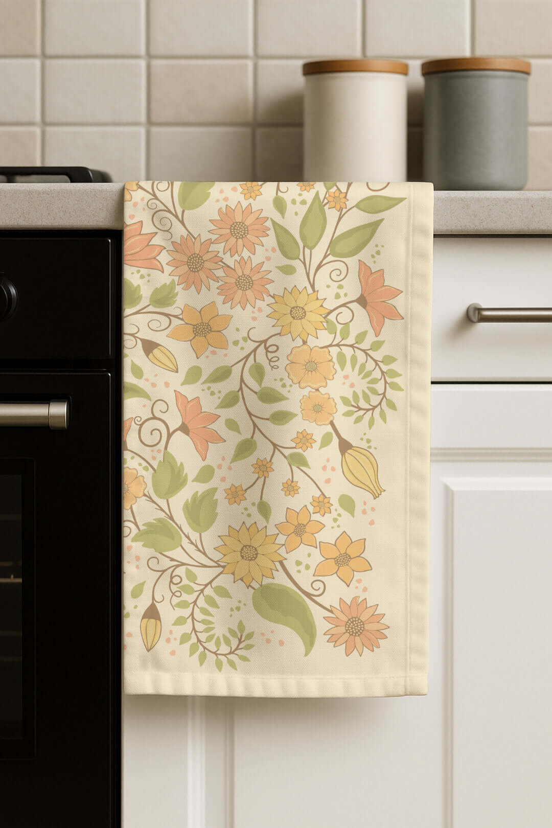 Floral Wilderness tea towel hanging in a kitchen setting, showcasing the botanical floral design in a real home environment.