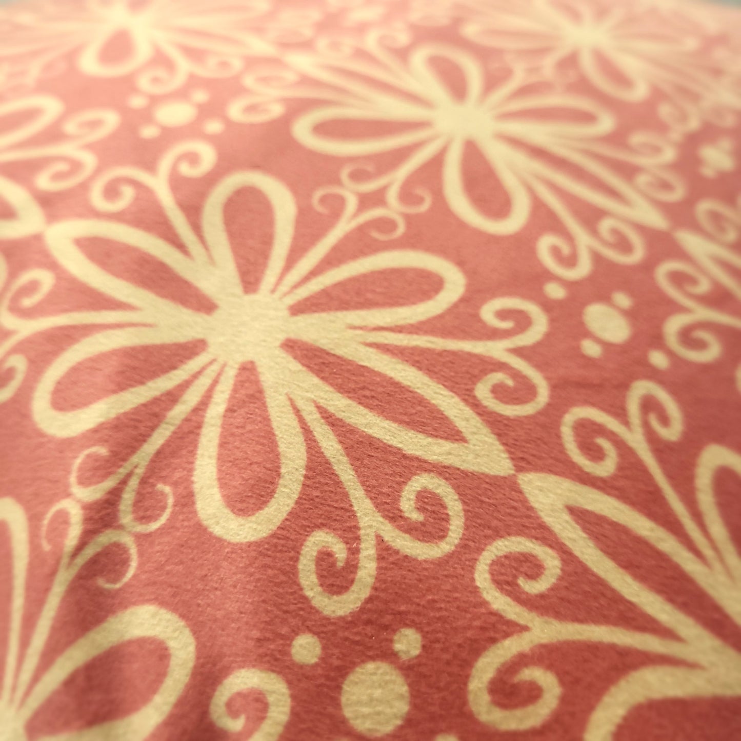 Close-up of pink geometric patterned velvet cushion cover
