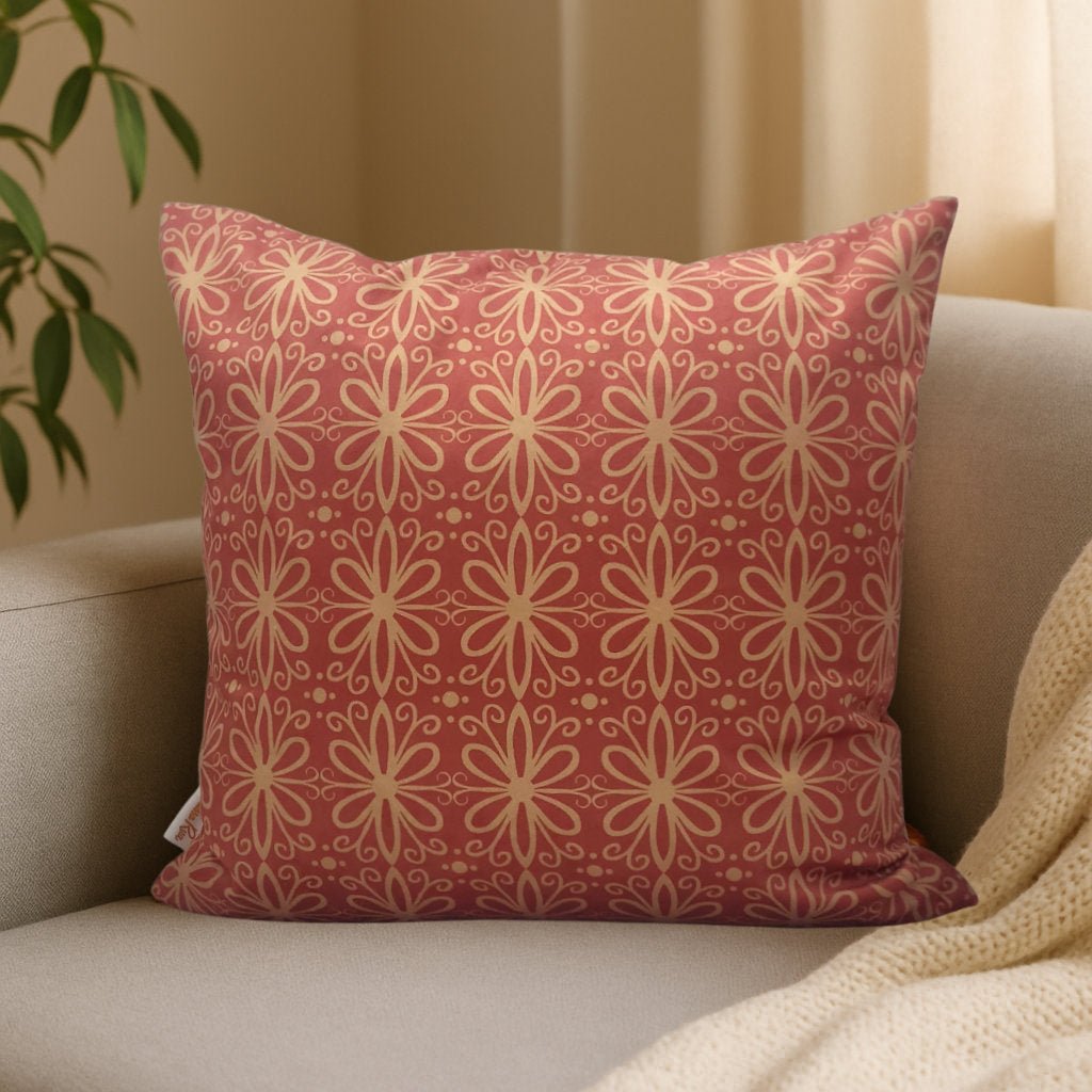 Pink geometric velvet cushion cover styled on sofa, modern decorative cushion