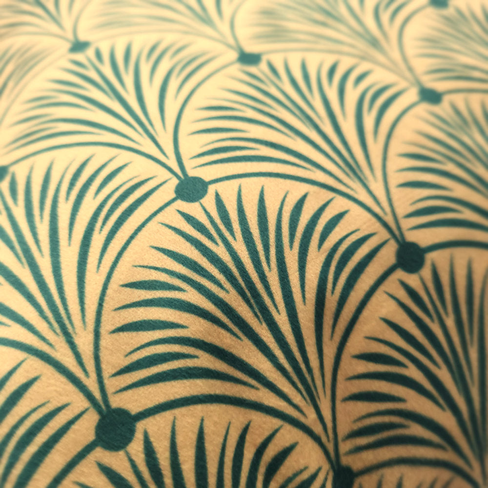 Close-up of Art Deco geometric pattern on luxury green velvet cushion cover
