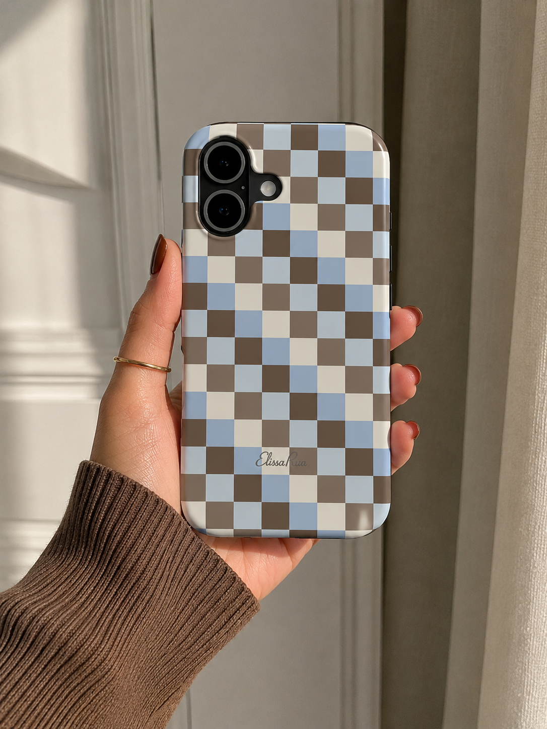 Tough phone case in blue and brown check pattern