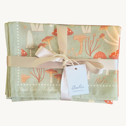 Folded Fabulous Funghi tea towel set of 3 with packaging, botanical mushroom kitchen towel gift set.