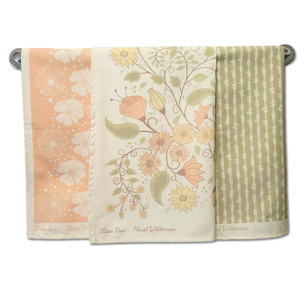 Designer tea towel set featuring three coordinated floral botanical prints from the Floral Wilderness collection, luxury kitchen towels set of 3.