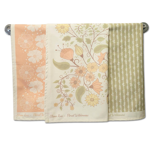 Designer tea towel set featuring three coordinated floral botanical prints from the Floral Wilderness collection, luxury kitchen towels set of 3.