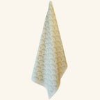 Green mushroom tea towel shown hanging, botanical kitchen linen from the Fabulous Funghi designer collection.