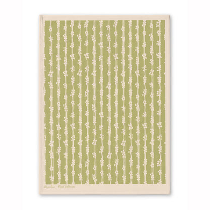 Green patterned tea towel with subtle botanical-inspired design, from the Floral Wilderness tea towel set.