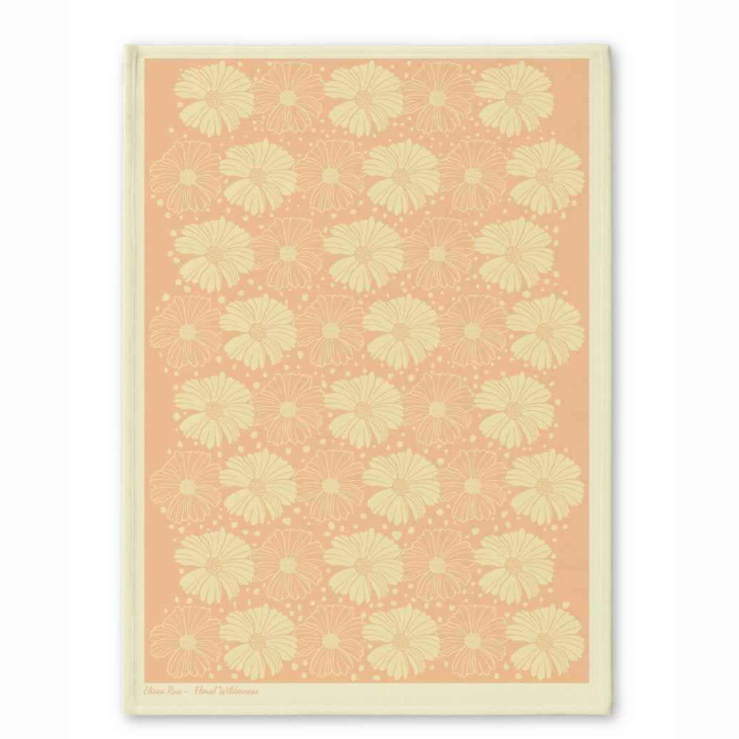 Peach floral patterned tea towel with soft botanical artwork, part of the Floral Wilderness designer collection.