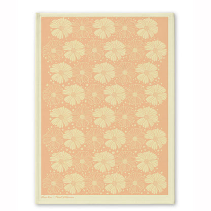 Peach floral patterned tea towel with soft botanical artwork, part of the Floral Wilderness designer collection.