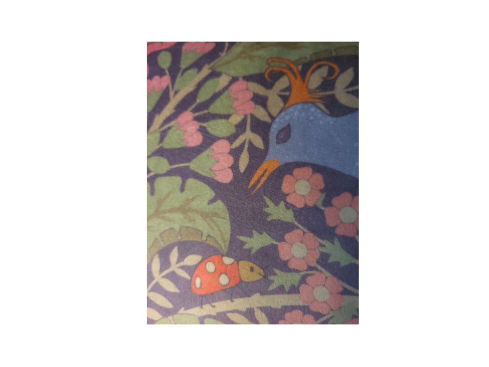 Close-up of peony and birds botanical artwork on luxury velvet cushion cover