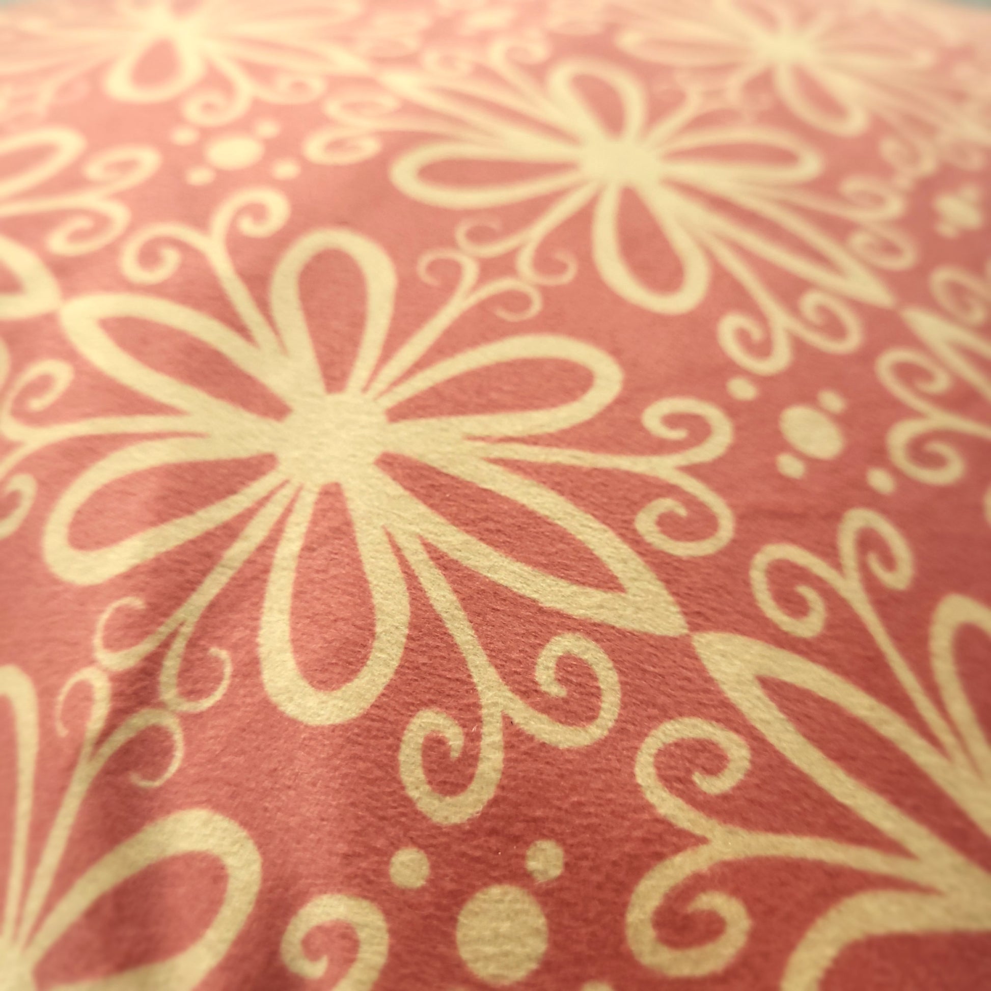 Close-up of pink geometric patterned velvet cushion cover