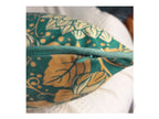 Detailed view of teal dahlia illustration on designer velvet cushion cover