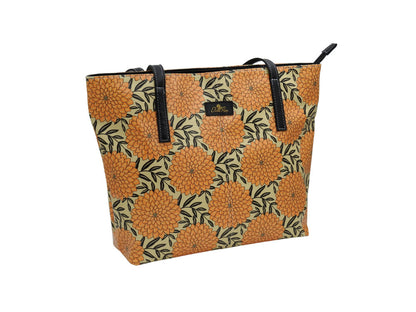 Yellow and black Dahlia tote bag by Elissa Rua — angled view showing artistic floral design and structured shape, women’s designer handbag.